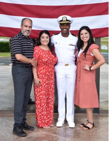 LT Javarri Beachum standing with his wife, Melissa, and his in-laws at his promotion to Lieutenant.